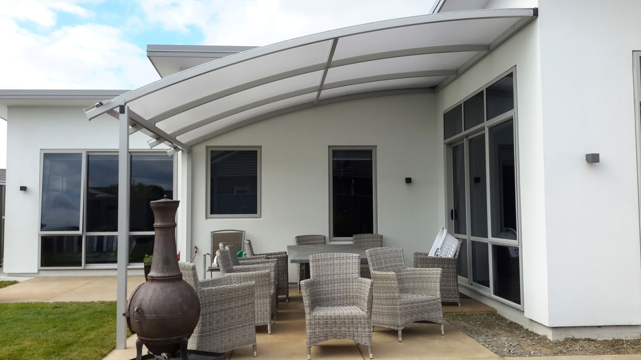 Curved Canopy Roof fixed to property, allowing diffused light