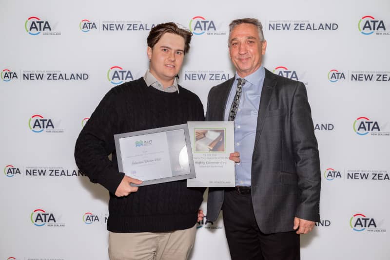 Seb receiving his award for outdoor upholstery apprentice of the year highly commended 2024